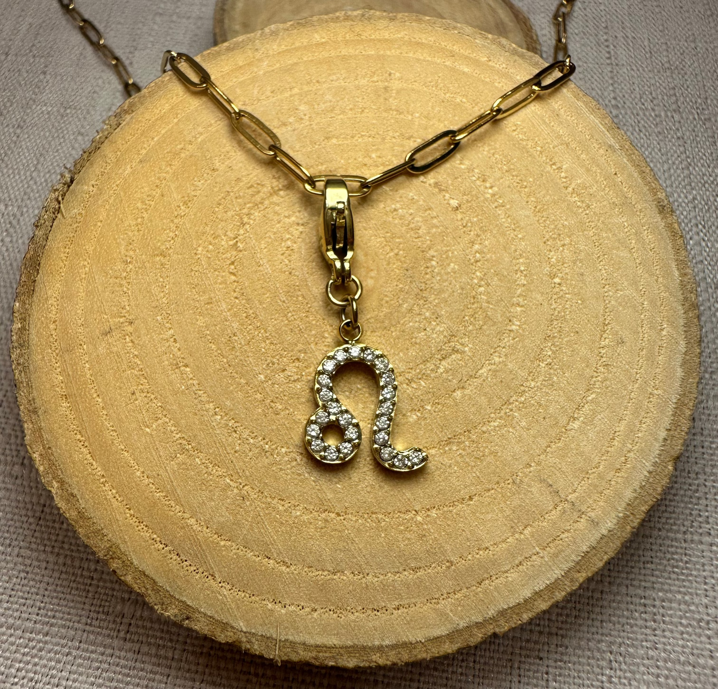 Signe astro doré strass Alaïa Bijoux