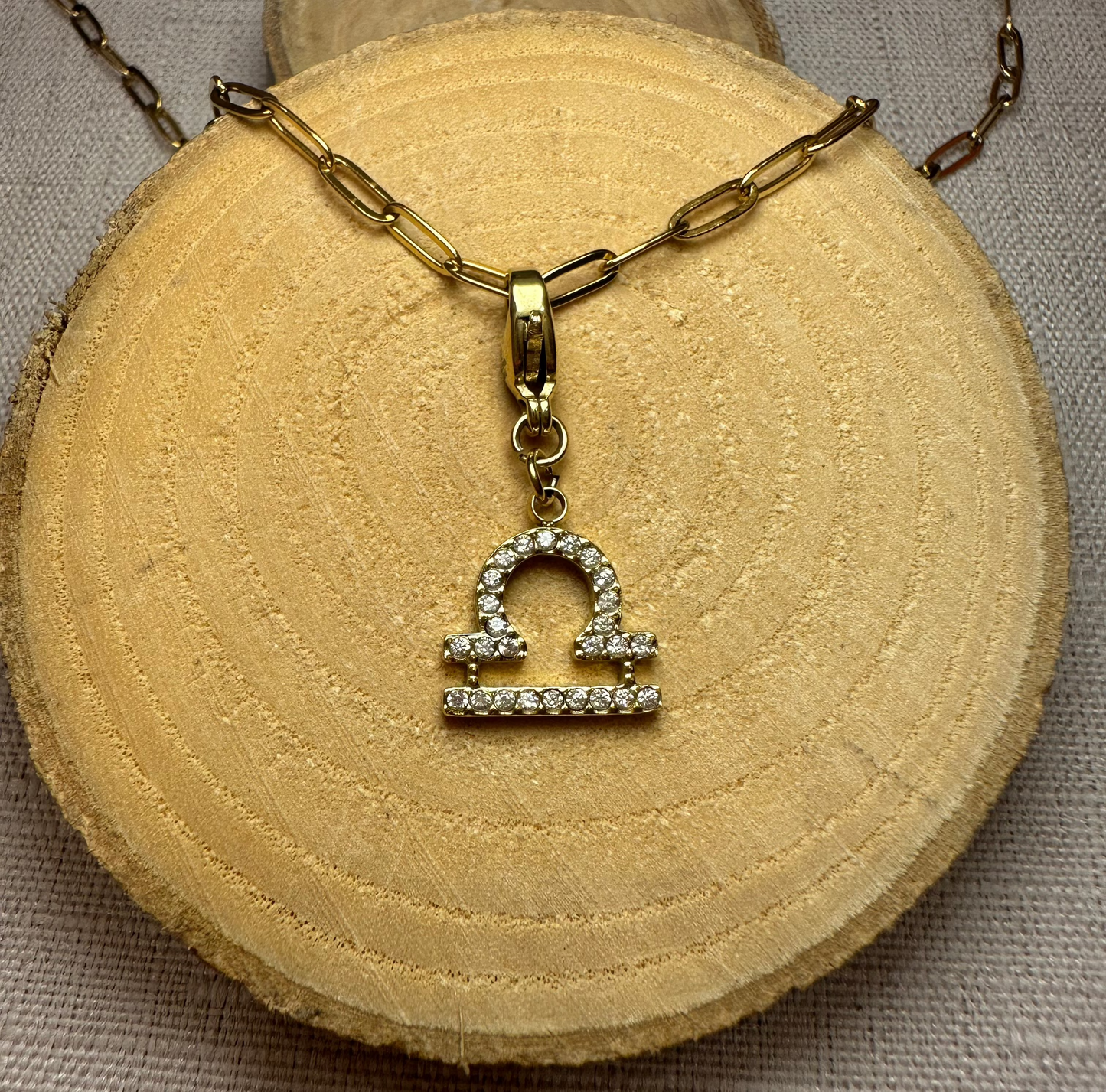 Signe astro doré strass Alaïa Bijoux