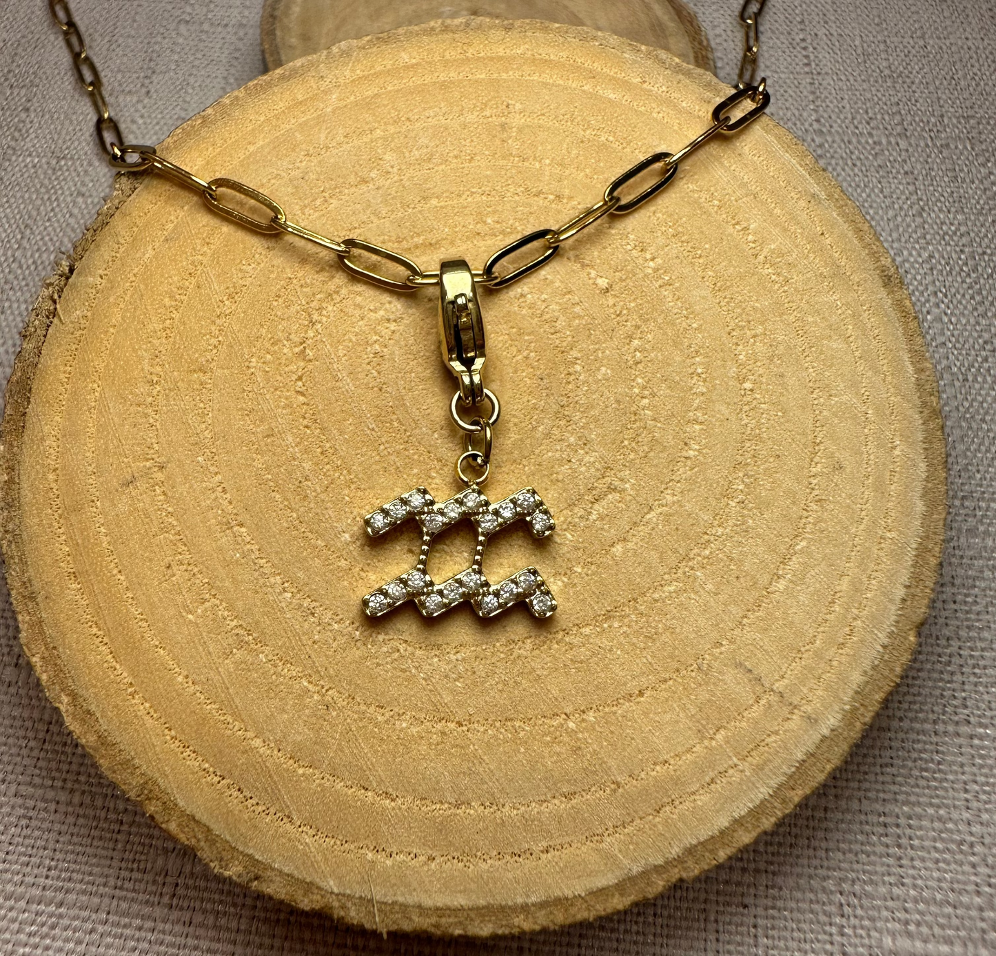 Signe astro doré strass Alaïa Bijoux