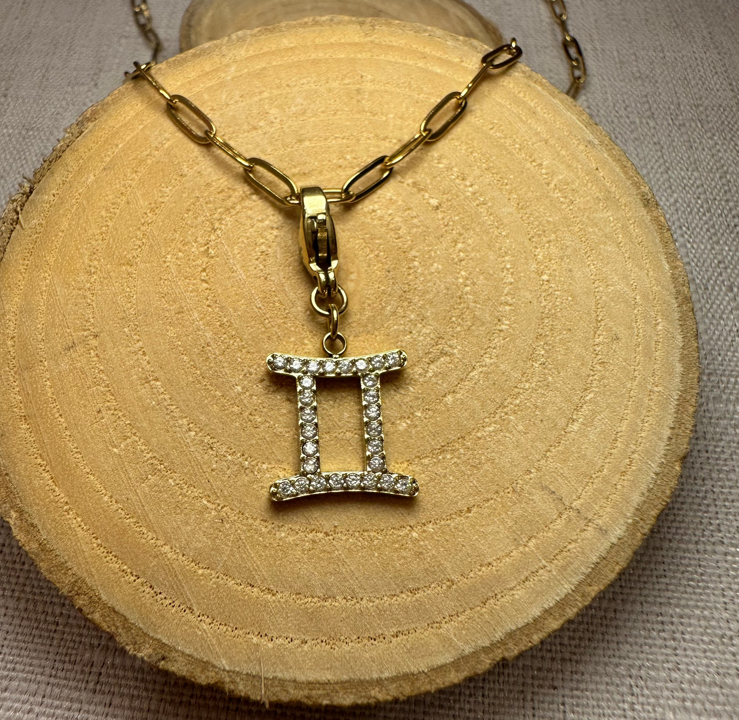 Signe astro doré strass Alaïa Bijoux