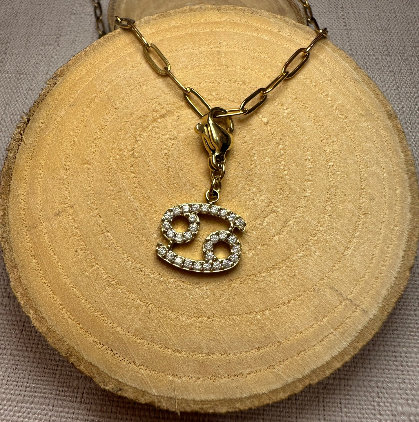 Signe astro doré strass Alaïa Bijoux