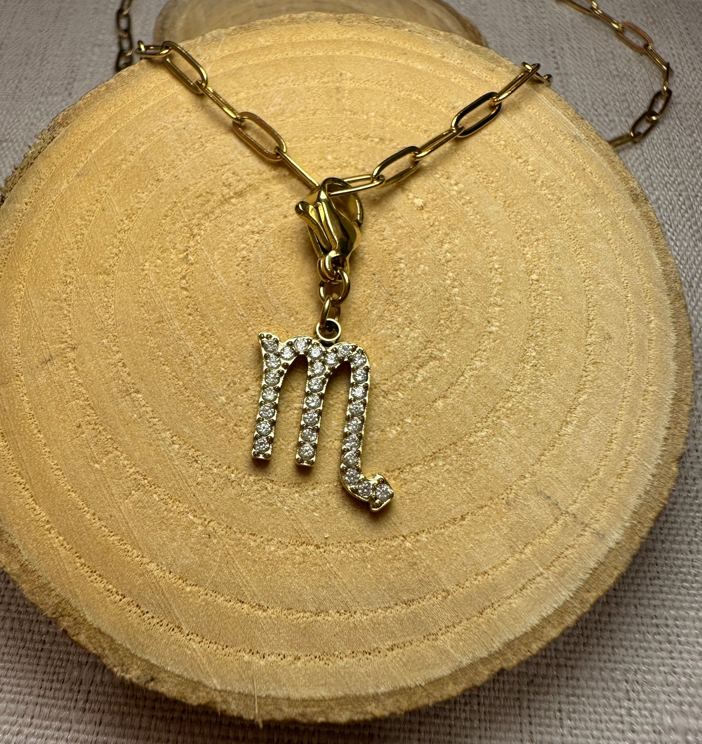 Signe astro doré strass Alaïa Bijoux