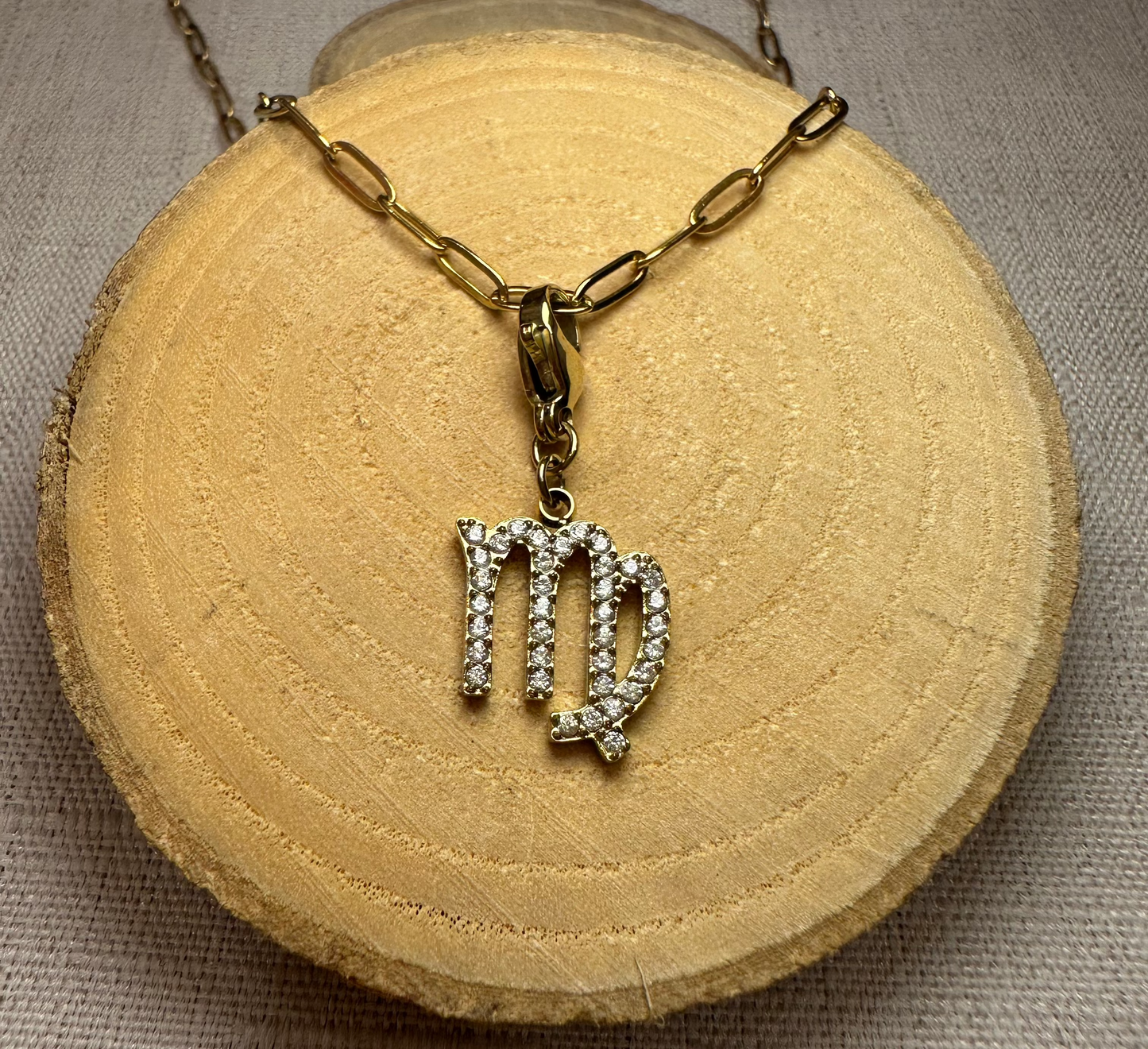 Signe astro doré strass Alaïa Bijoux