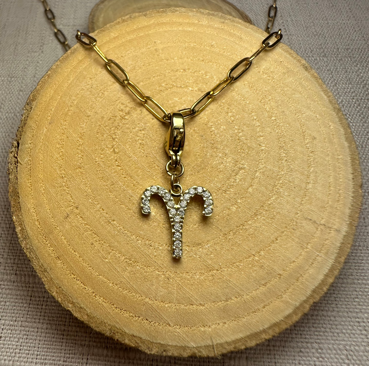 Signe astro doré strass Alaïa Bijoux