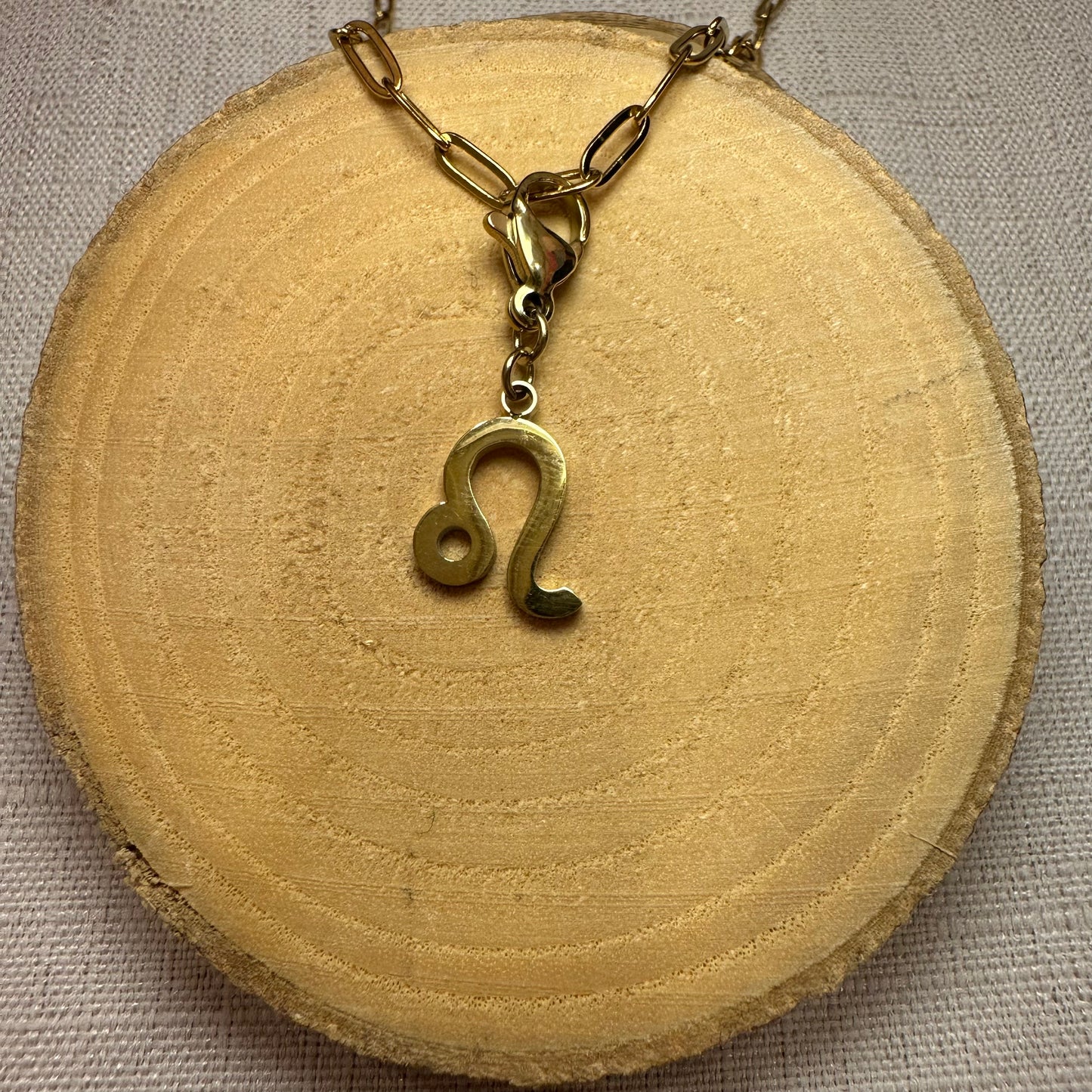 Signe astro doré Alaïa Bijoux