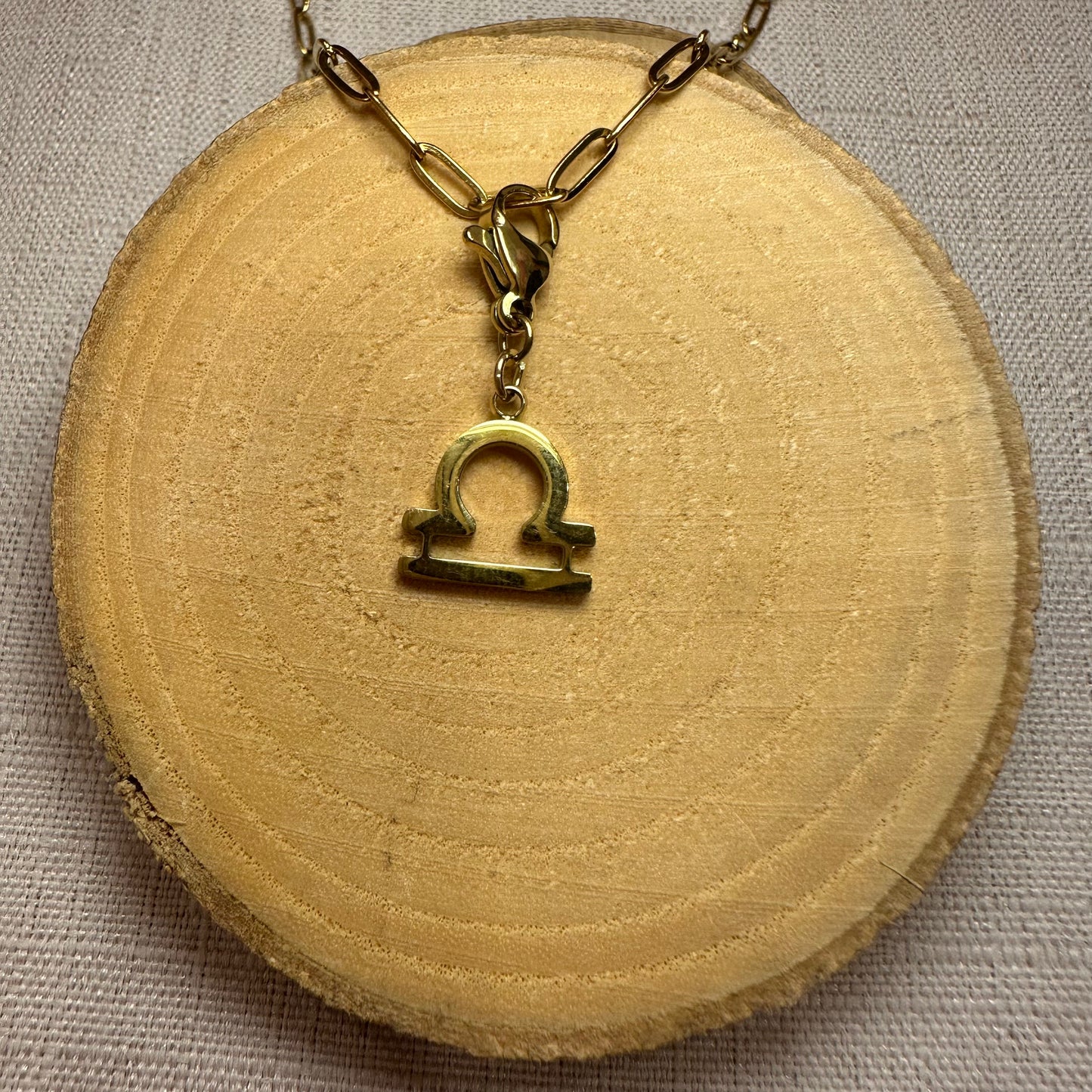 Signe astro doré Alaïa Bijoux
