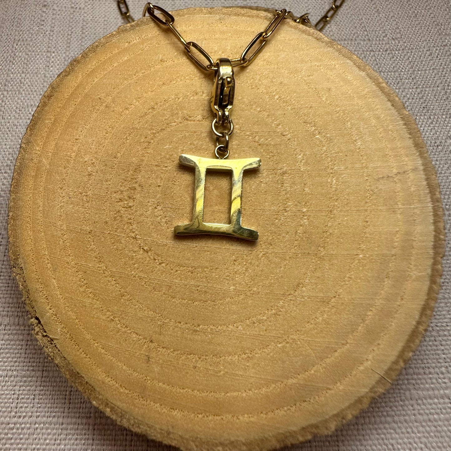 Signe astro doré Alaïa Bijoux