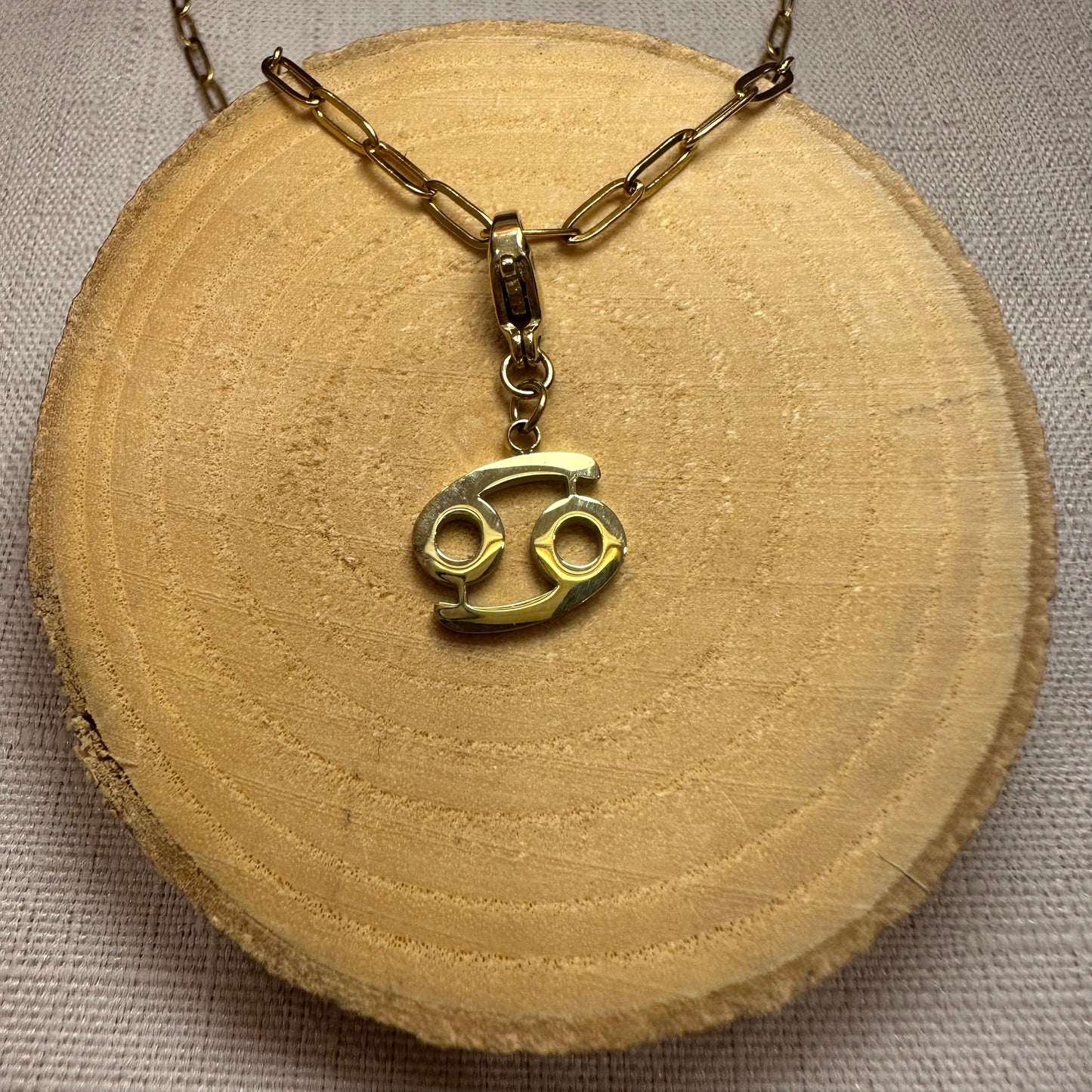 Signe astro doré Alaïa Bijoux