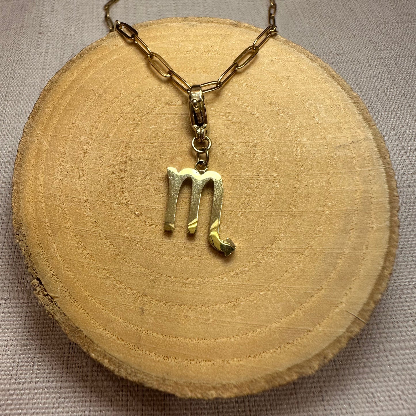 Signe astro doré Alaïa Bijoux