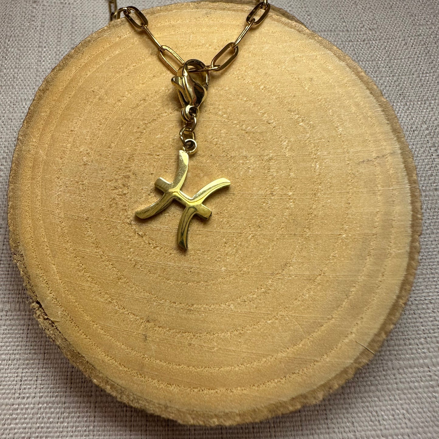 Signe astro doré Alaïa Bijoux