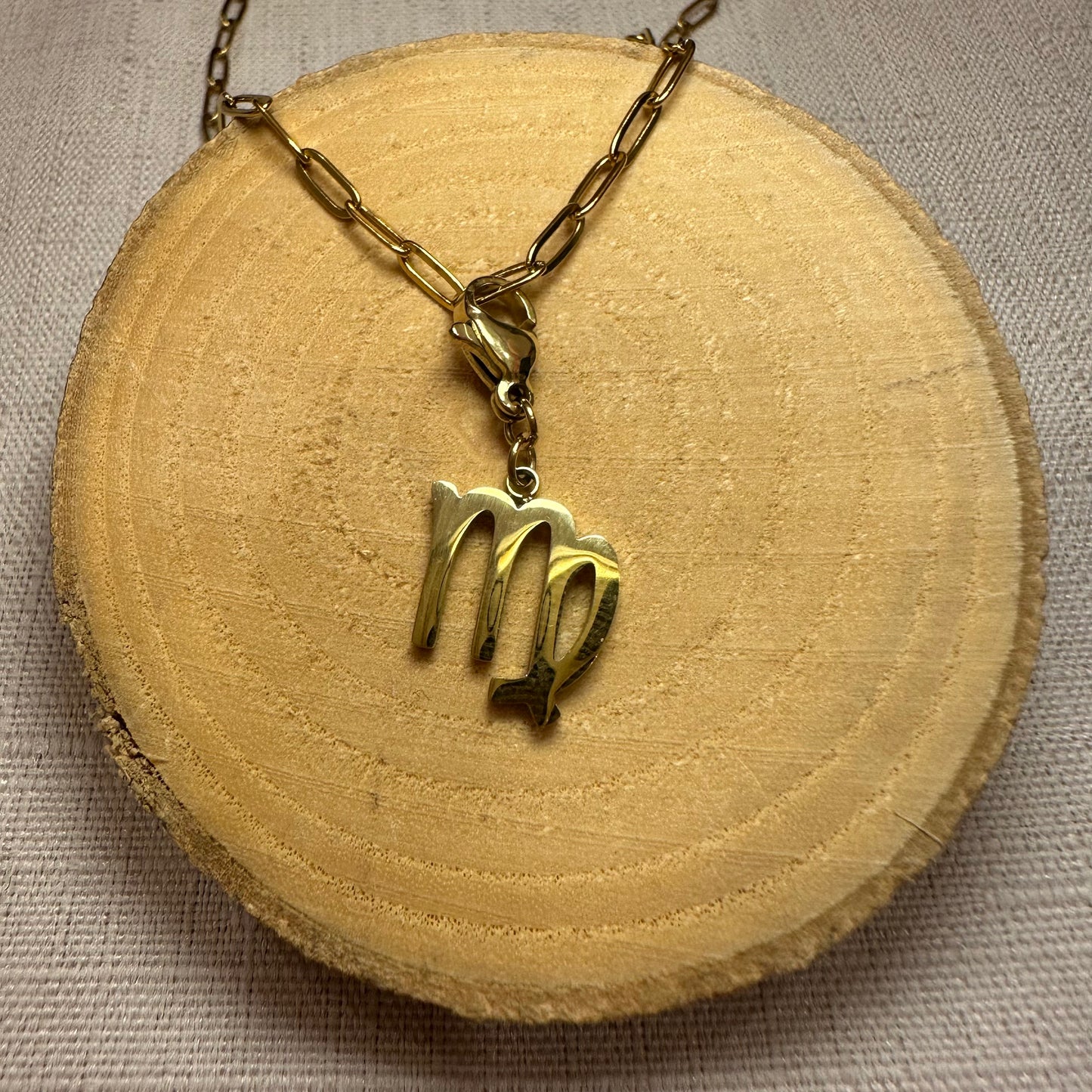 Signe astro doré Alaïa Bijoux