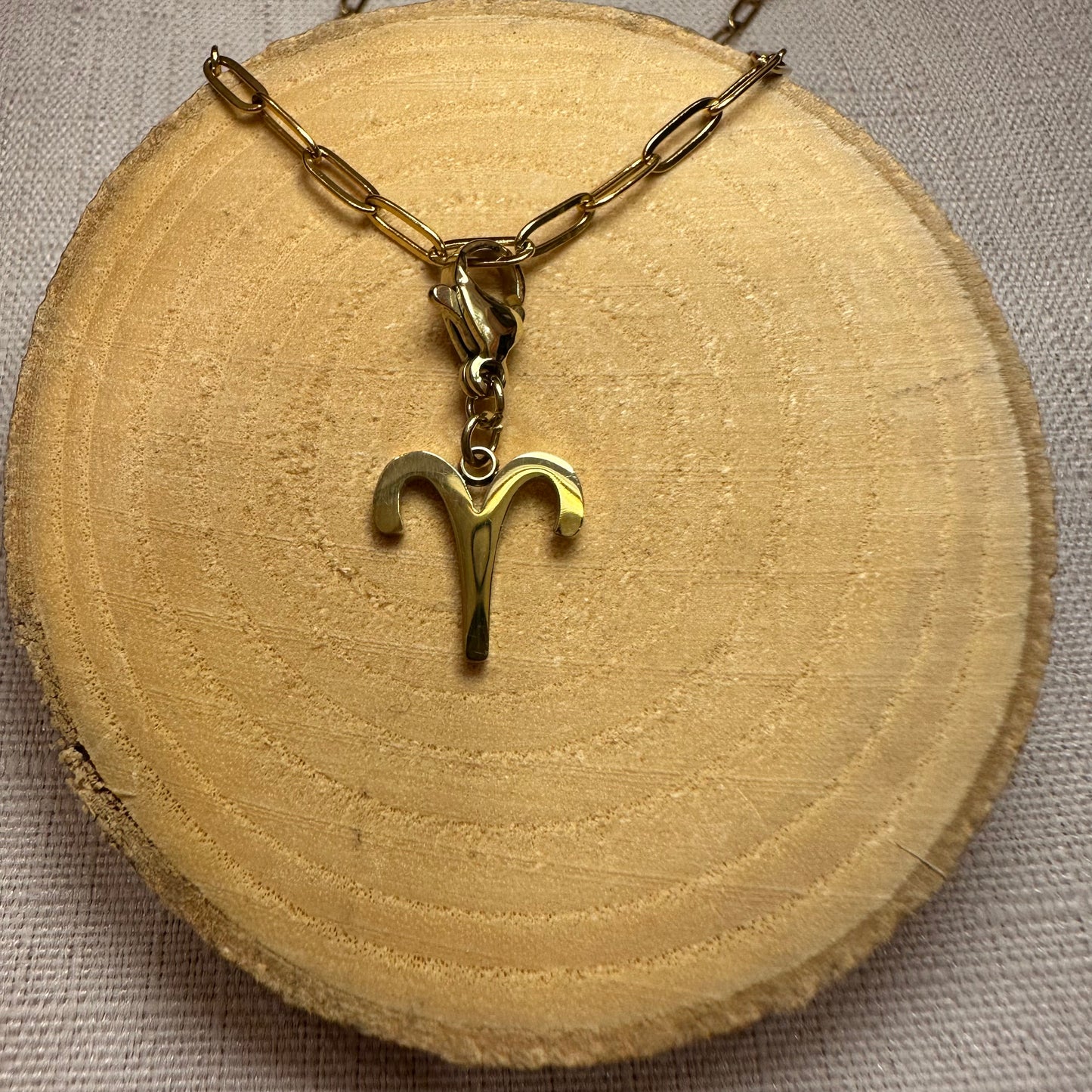 Signe astro doré Alaïa Bijoux