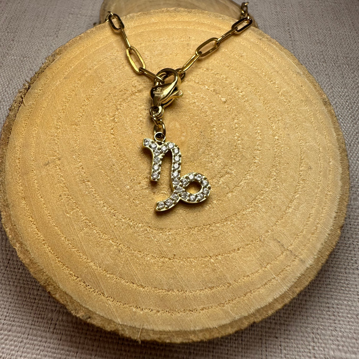 Signe astro doré strass Alaïa Bijoux
