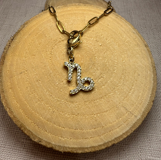 Signe astro doré strass Alaïa Bijoux