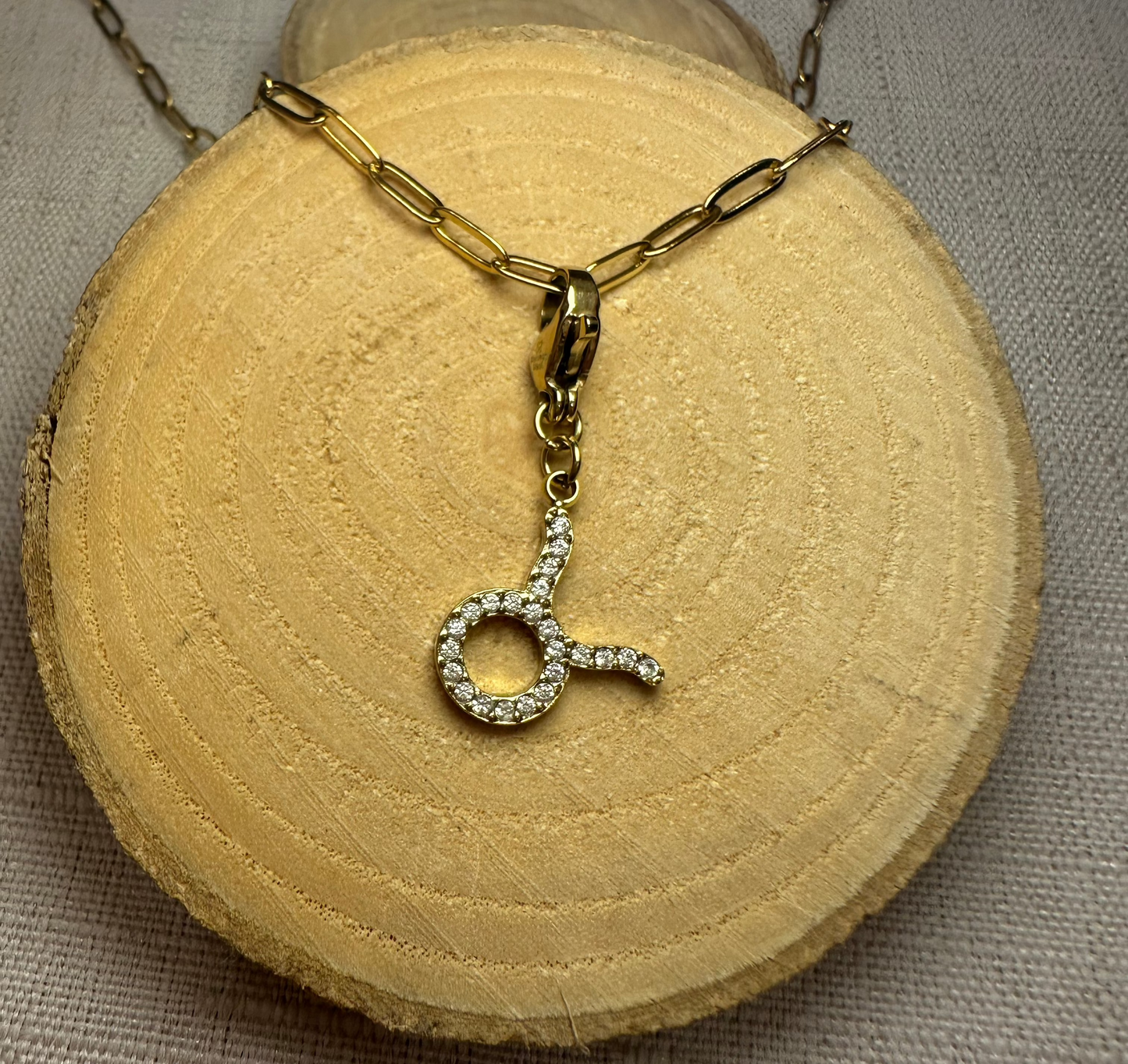 Signe astro doré strass Alaïa Bijoux