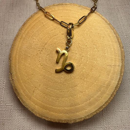 Signe astro doré Alaïa Bijoux